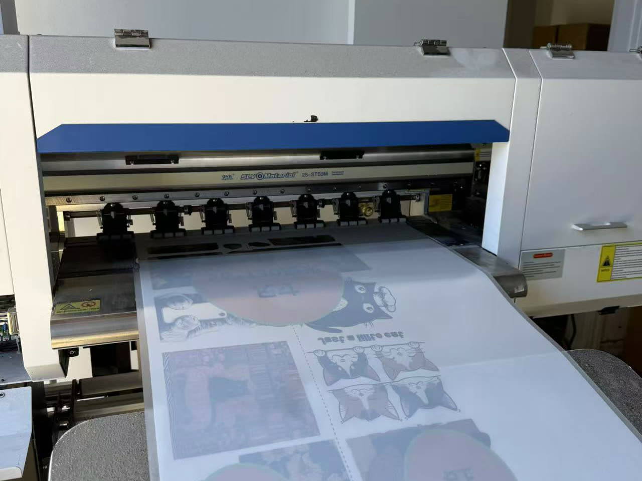 Full-color transfers coming off our DTF printer