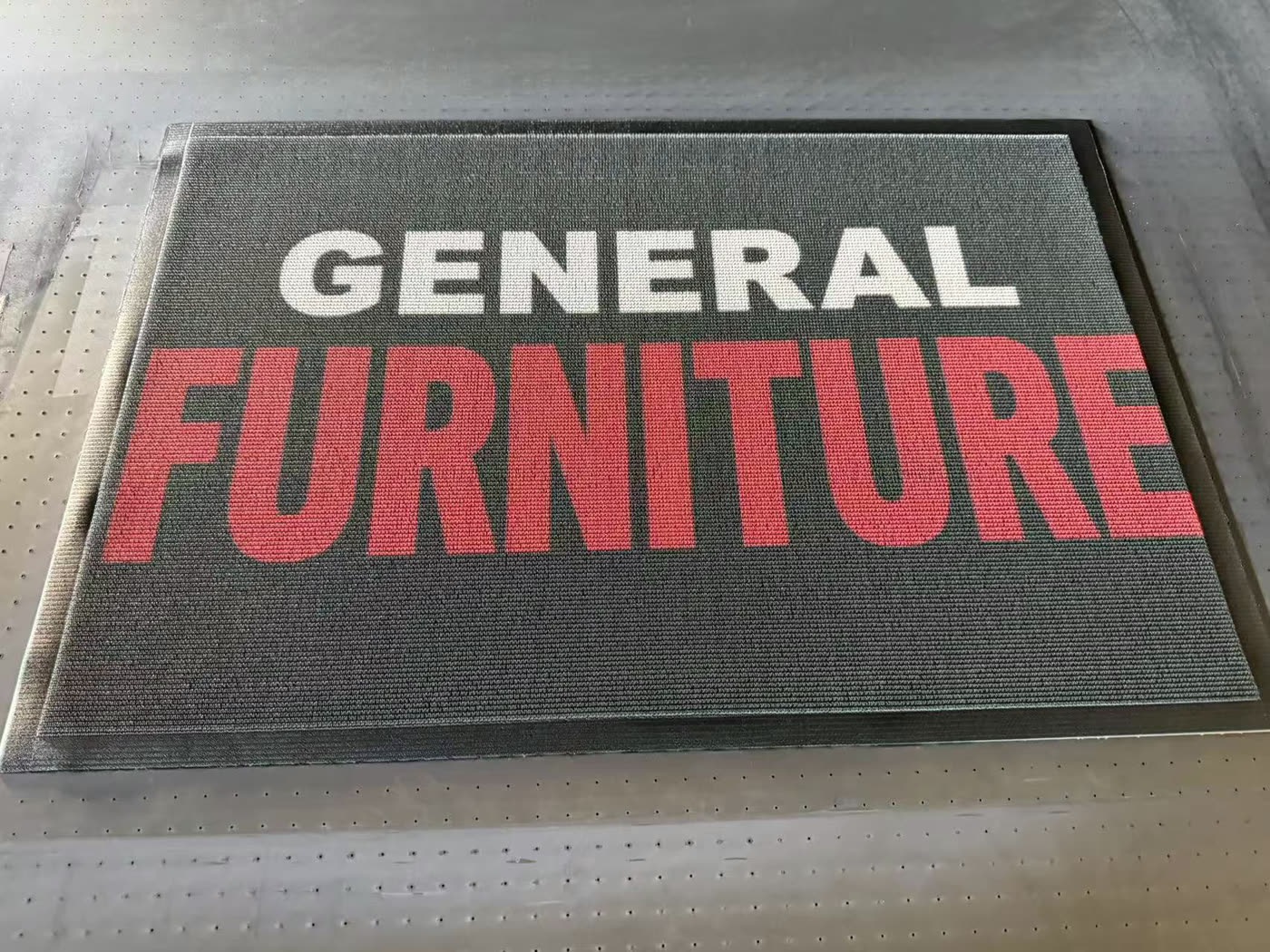 A coil entrance mat we printed with a business logo