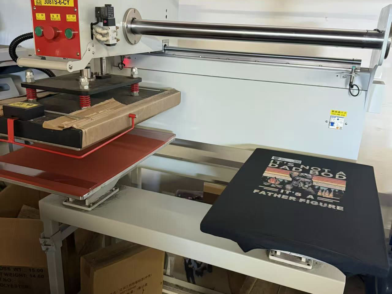 Heat-pressing a DTF transfer onto a garment in our shop